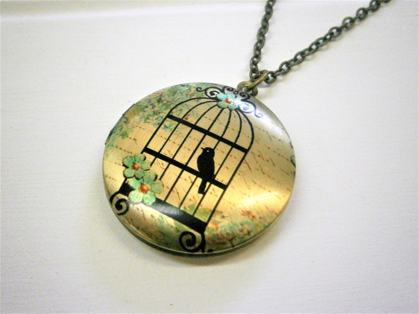 Vintage Style Picture Locket Necklace/Antique Bronze Locket with detailed Photo of a Bird in a Vintage Style Cage/Long Necklace.