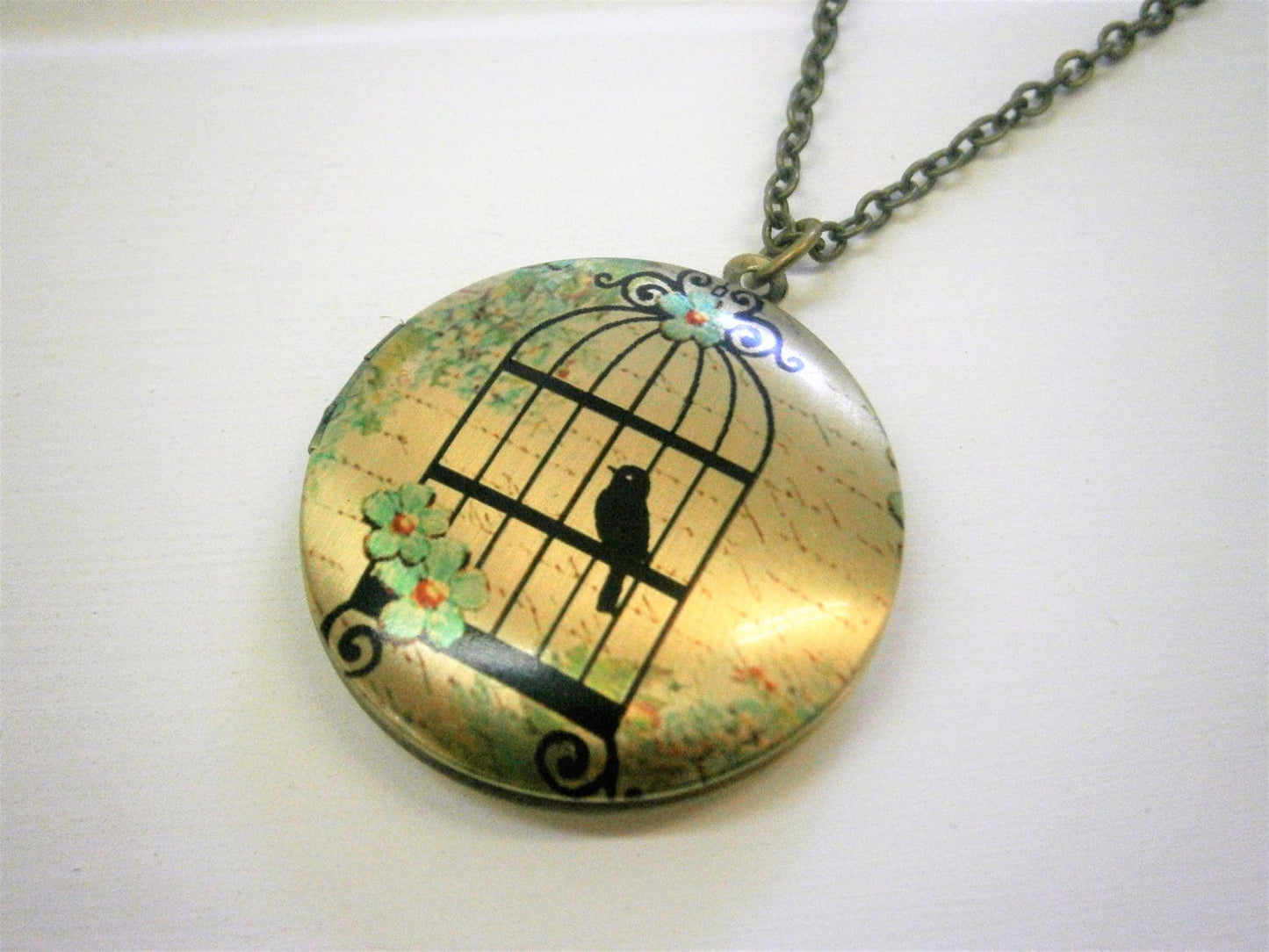 Vintage Style Picture Locket Necklace/Antique Bronze Locket with detailed Photo of a Bird in a Vintage Style Cage/Long Necklace.
