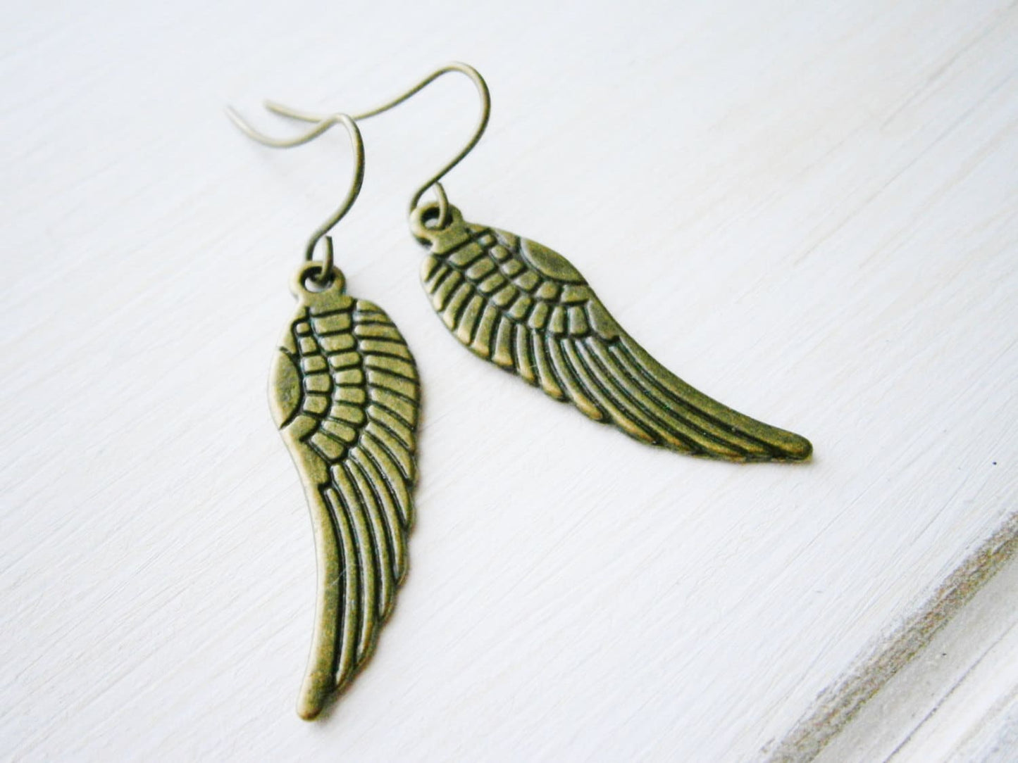 Angel Wing Antique Bronze Charm On Antique Bronze French Earring Hooks/Dangle Earrings.