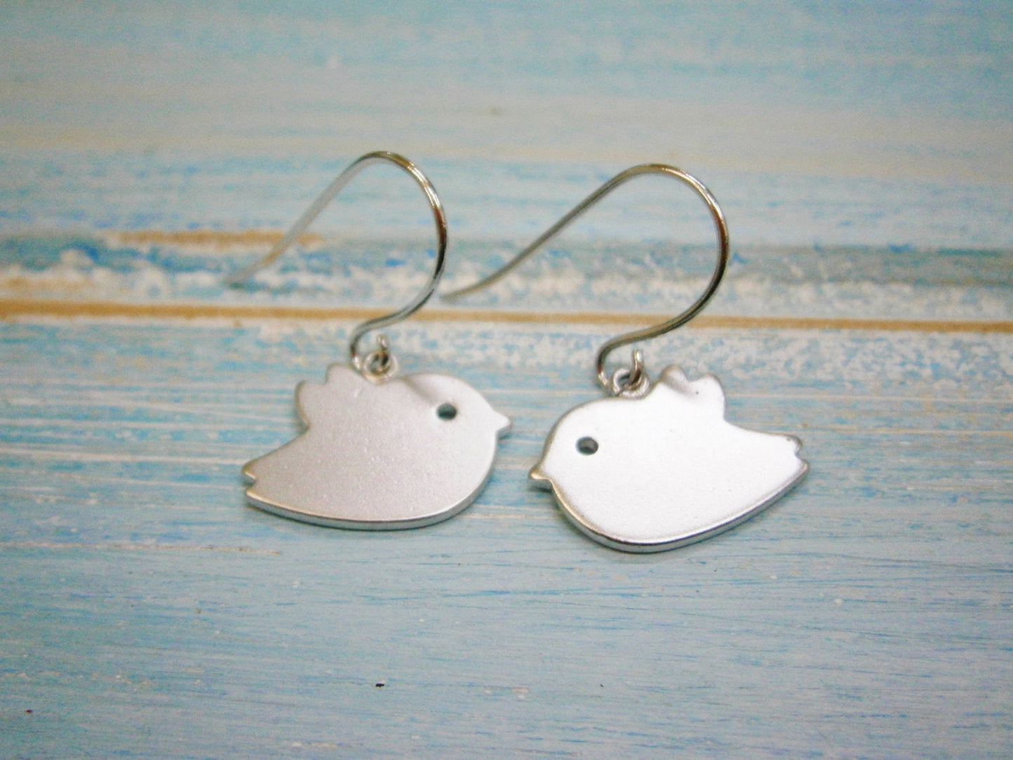 Matt Rhodium Plated Bird Charm On Rhodium Plated French Earring Hooks/Dangle Earrings.