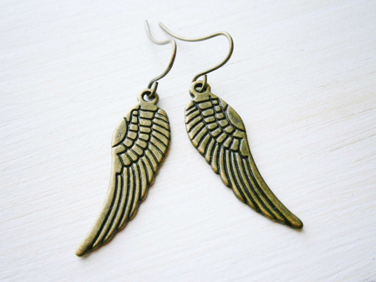 Angel Wing Antique Bronze Charm On Antique Bronze French Earring Hooks/Dangle Earrings.